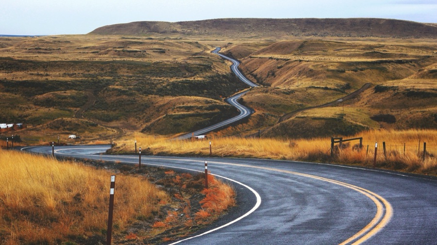 A long, winding road through hills, illustrating the road to clinical translation